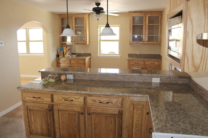 Renovated kitchen with timber cabinetry and stone island